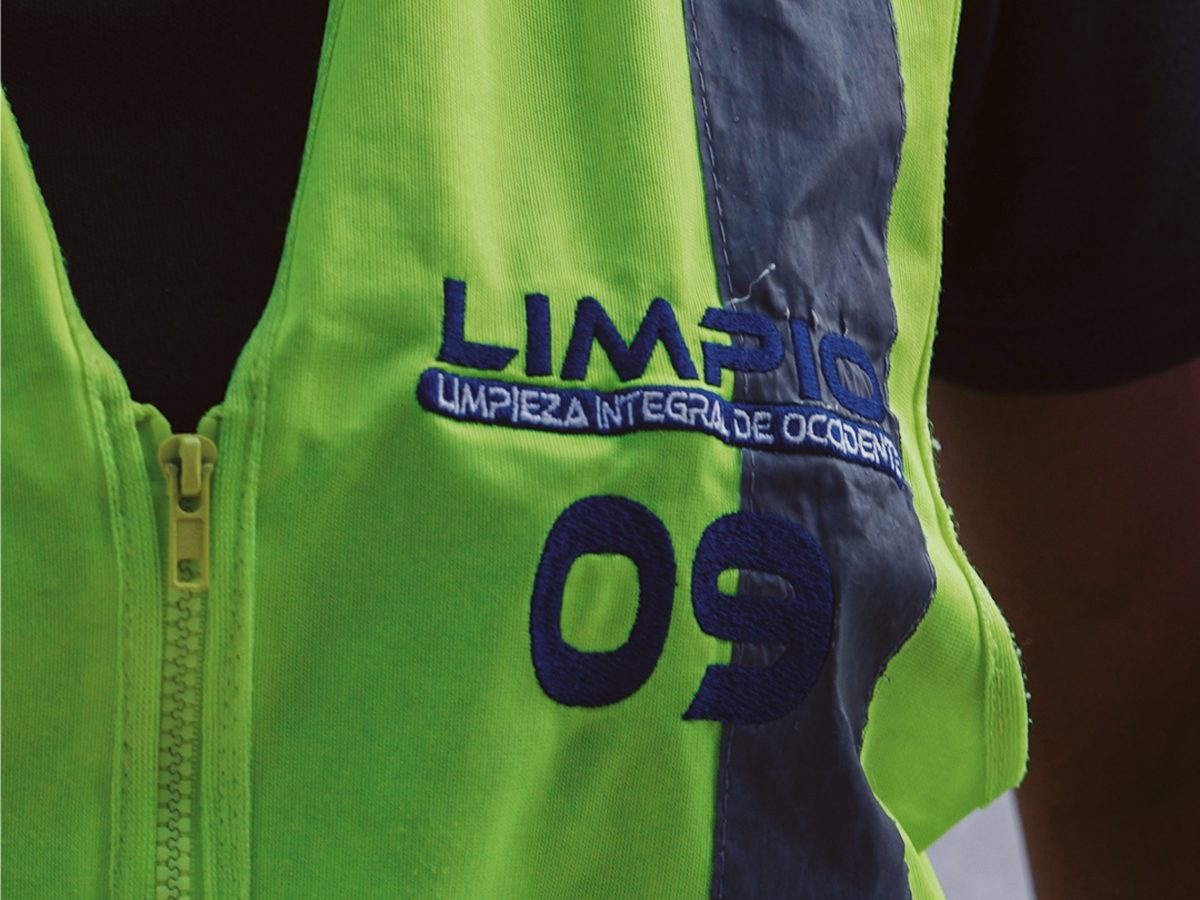 Limpio Colombia operations uniform with embroidered logo and ID number.