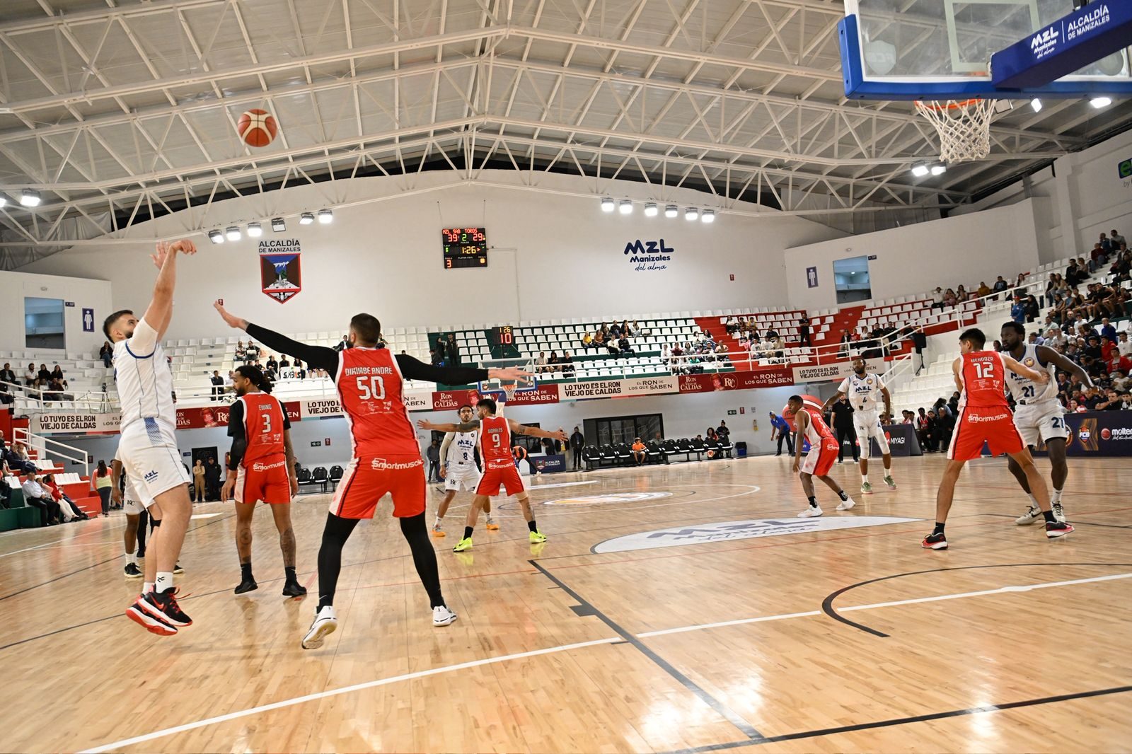 Toros del Valle professional basketball game with sponsor LED panels active on court.